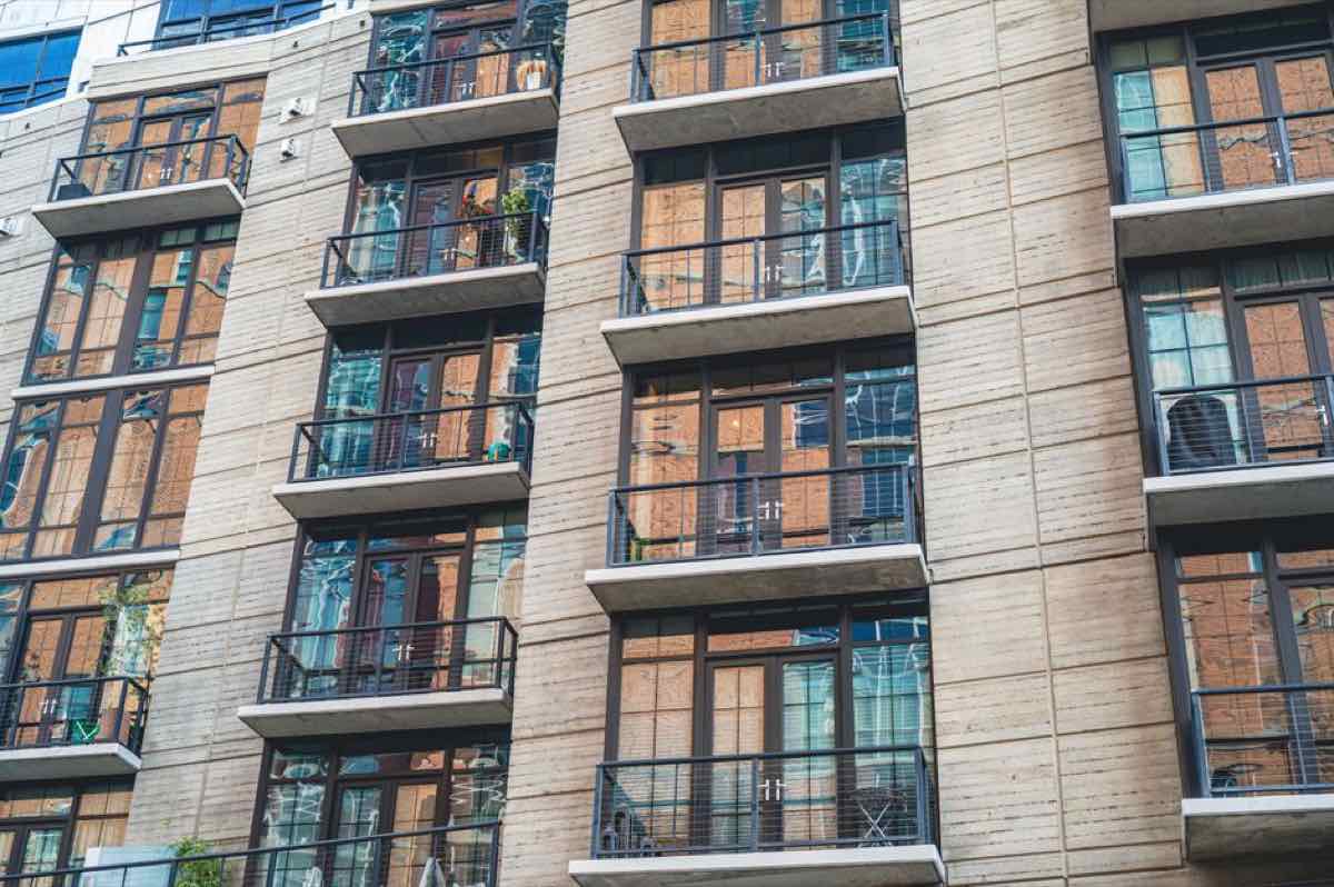Modern apartment building exterior with balconies, the kind of property a South Shore property manager oversees