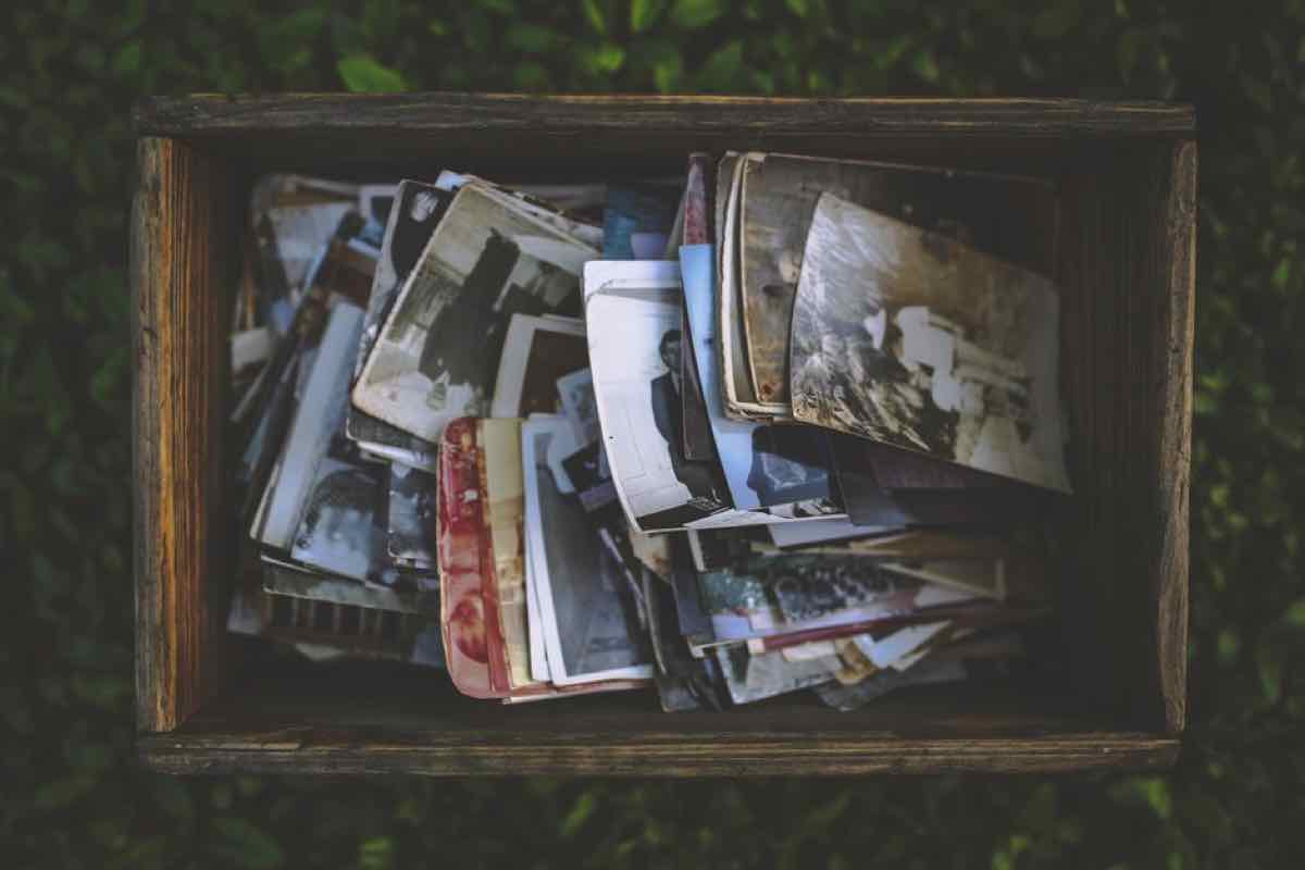 Wooden box full of old family photographs and keepsakes