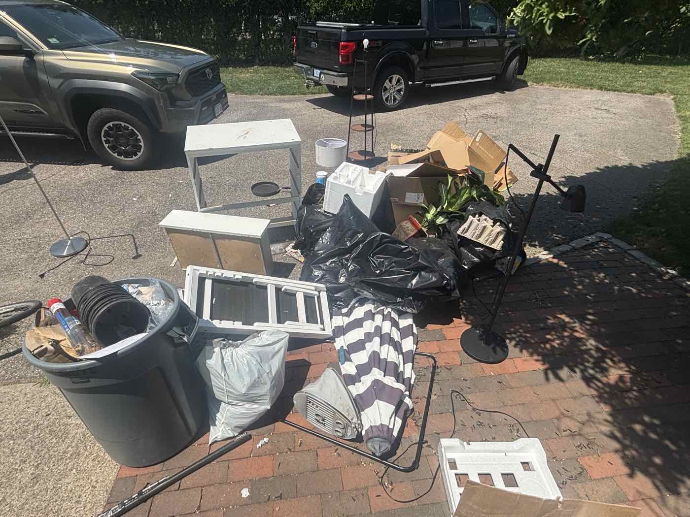 Dumpster Dudes truck parked in a residential driveway in Rockland, MA